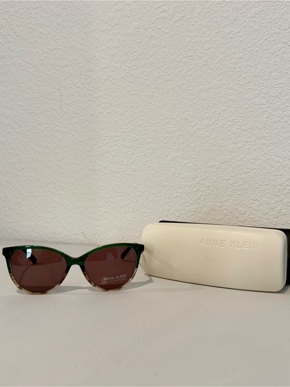 Anne Klein Translucent Green Cat-Eye Sunglasses with Brown Lenses